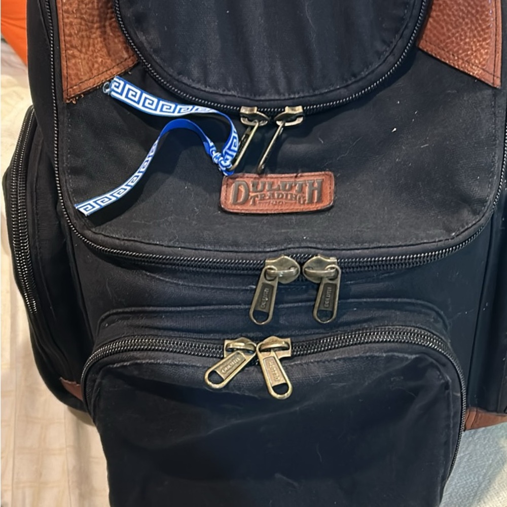 Duluth Black and Brown Backpack with Durable Canvas and Antique Brass Hardware